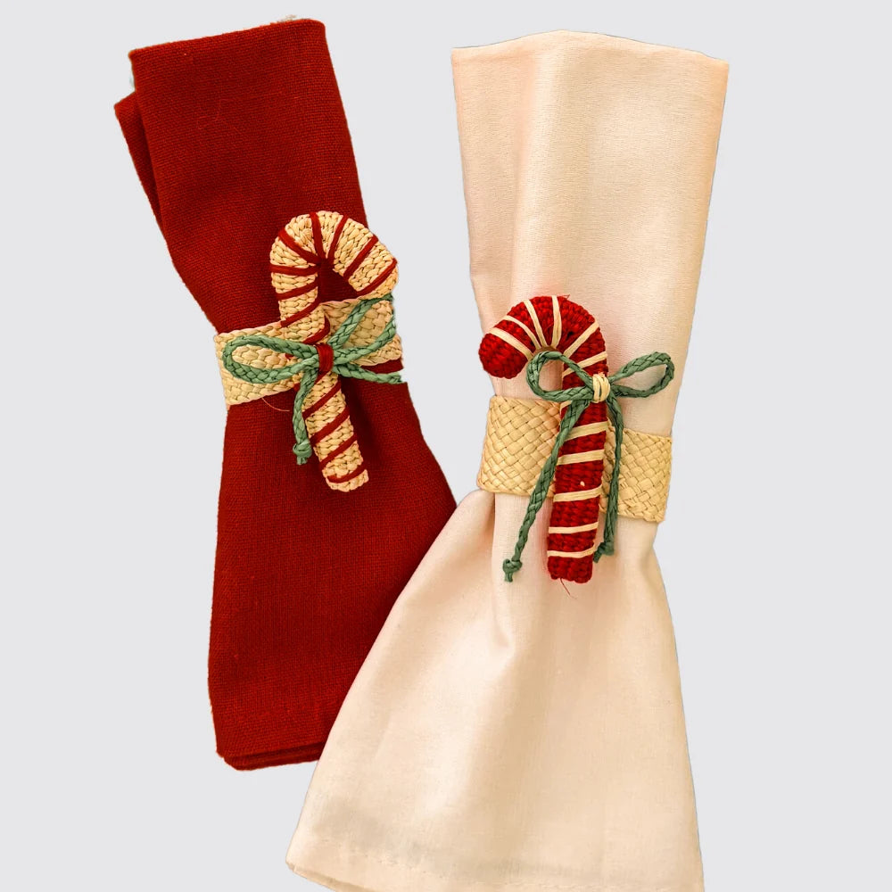 Two red and natural coloured candy cane napkin rings.