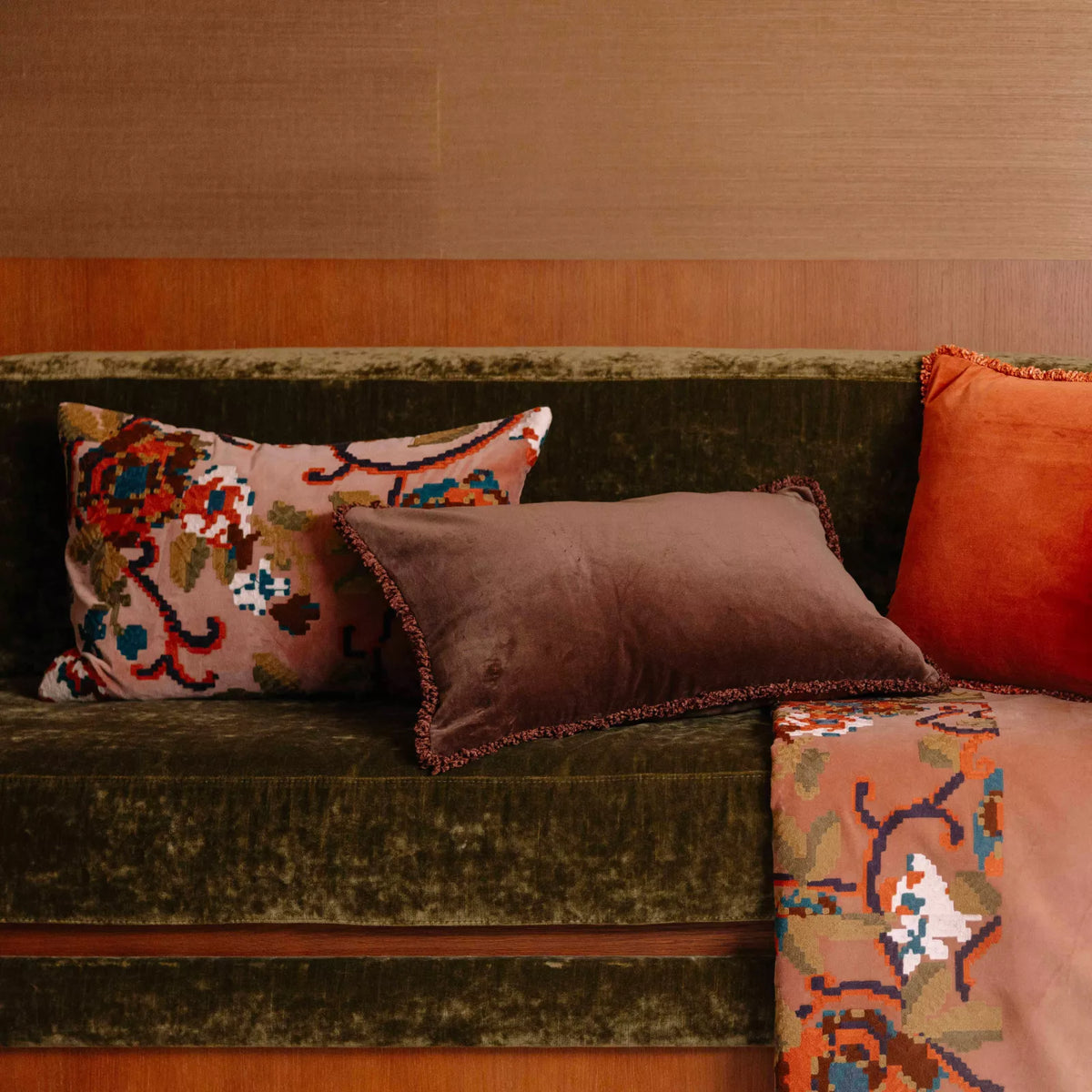 Kendal embroidered cushions mixed with plain velvert