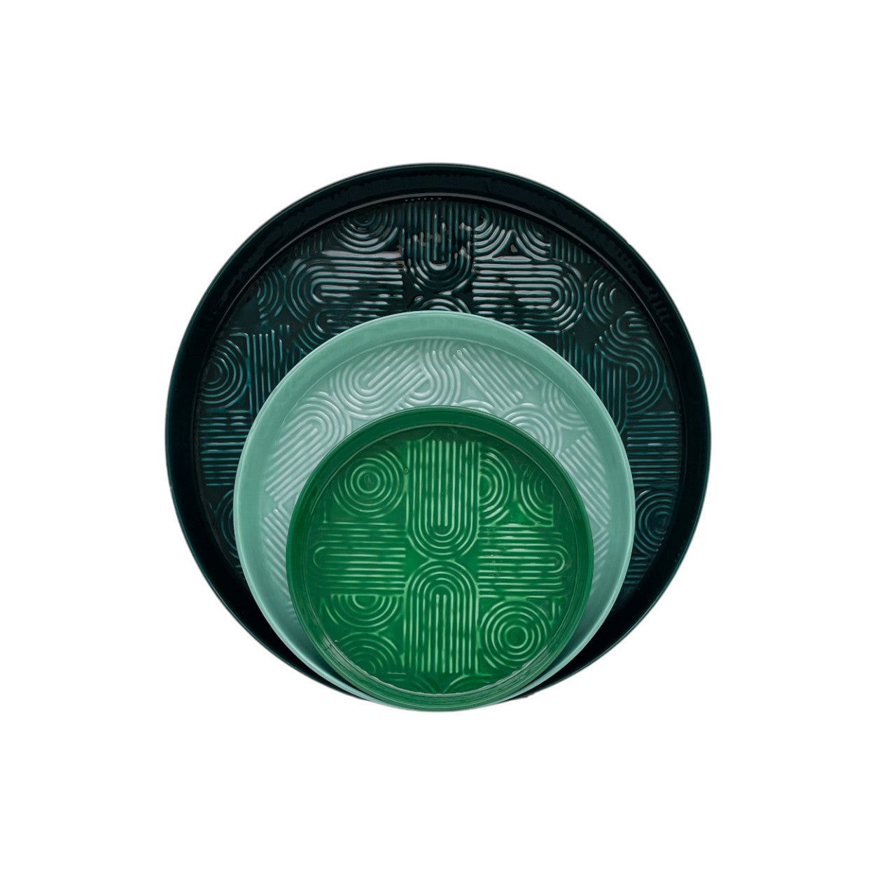 Set of green plates with geometric patterns on the base of the plate.