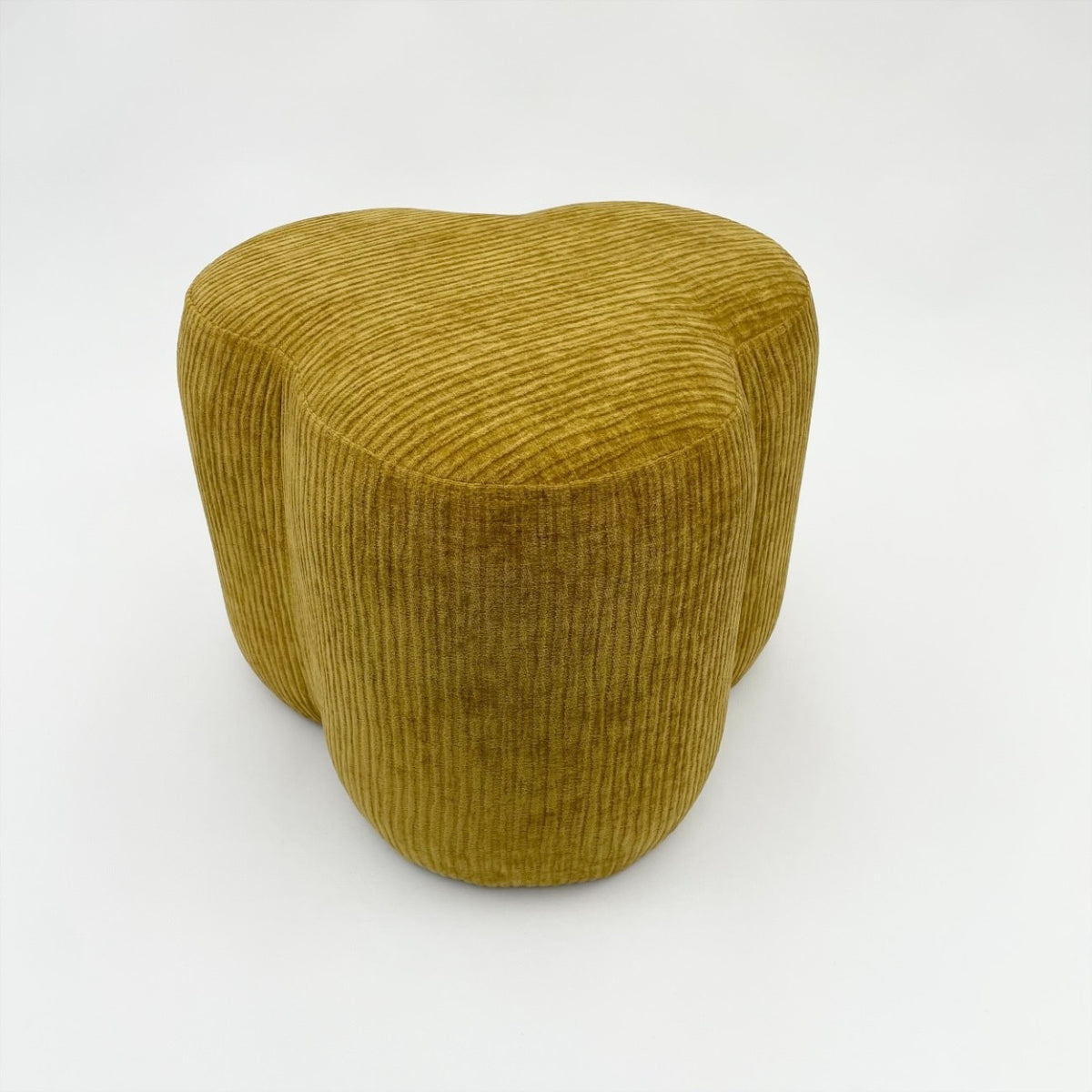 Mustard cord pouffe footstool.