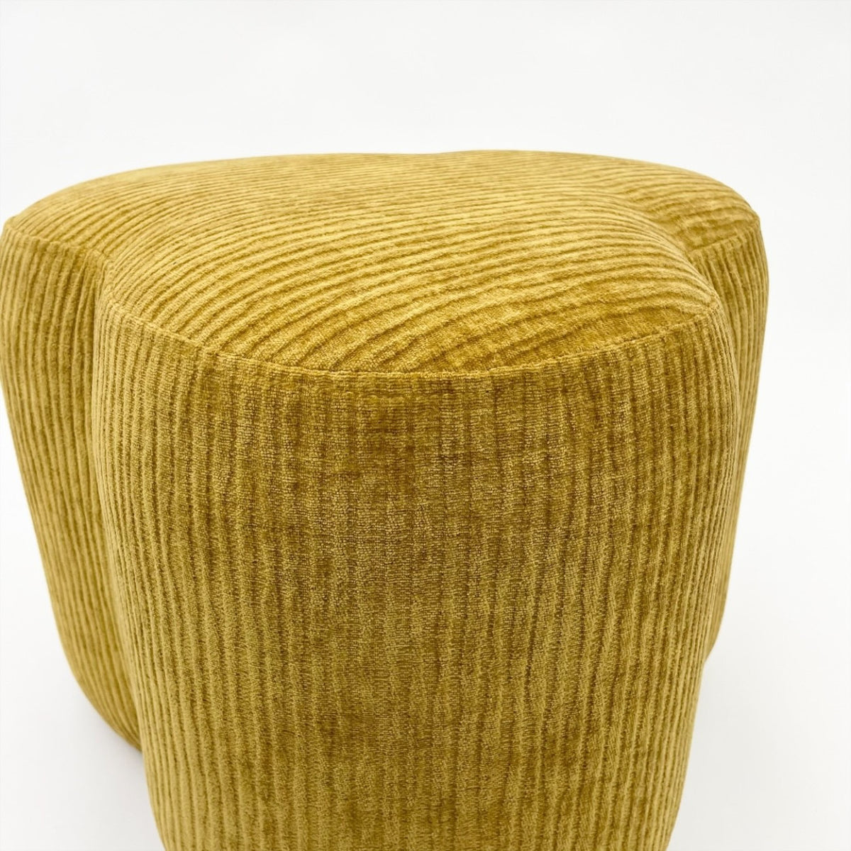 Mustard cord pouffe.