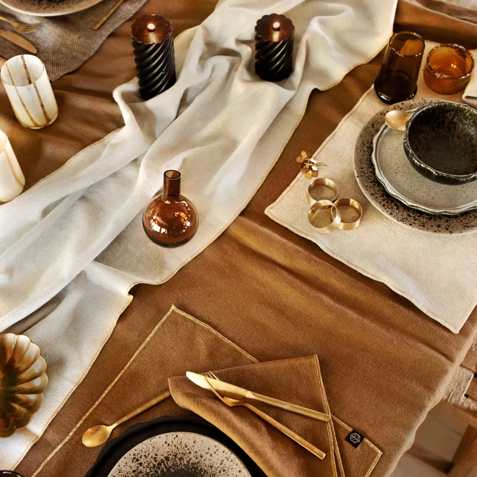 Verona gold linen/cotton table runner and napkins set at a table.